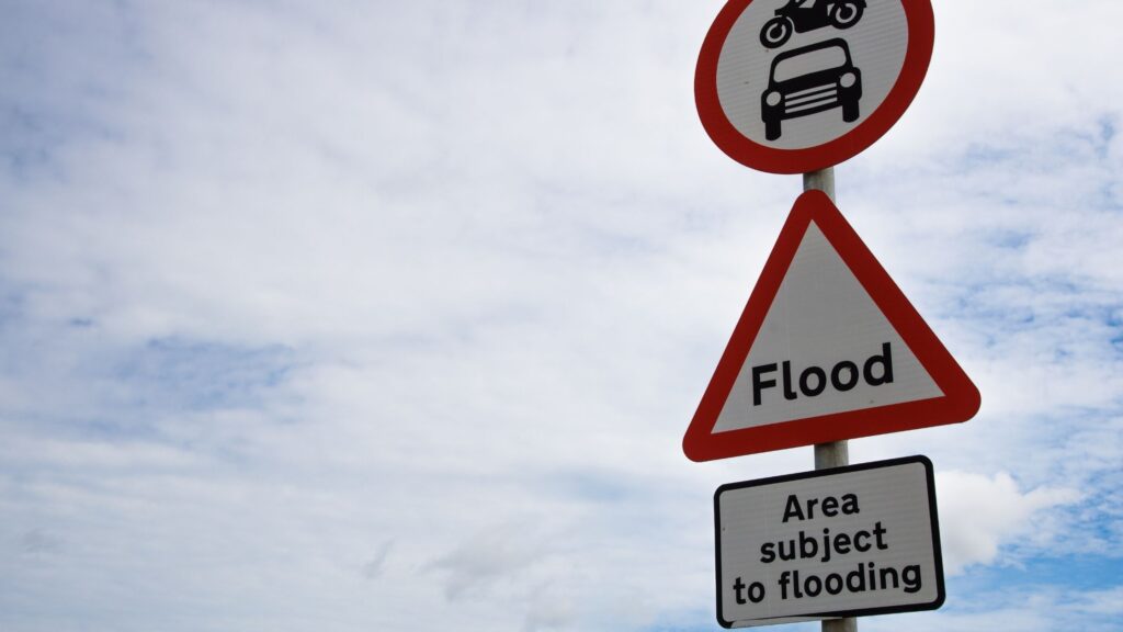 Flood warning road signs saying area subject to flooding